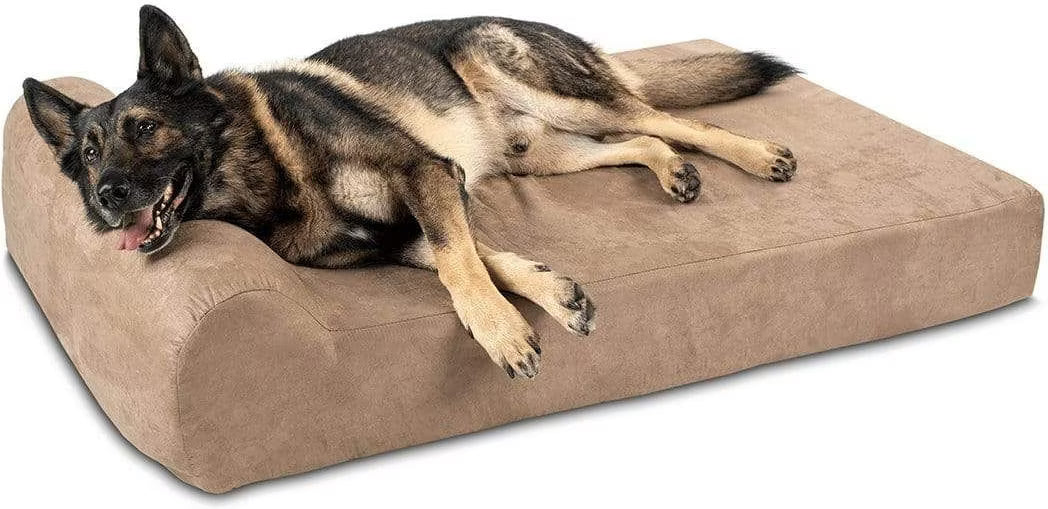 A German Shepherd dog lies stretched out on a large, rectangular, low-profile pet bed with a brown microfiber fabric, set against a plain white background.